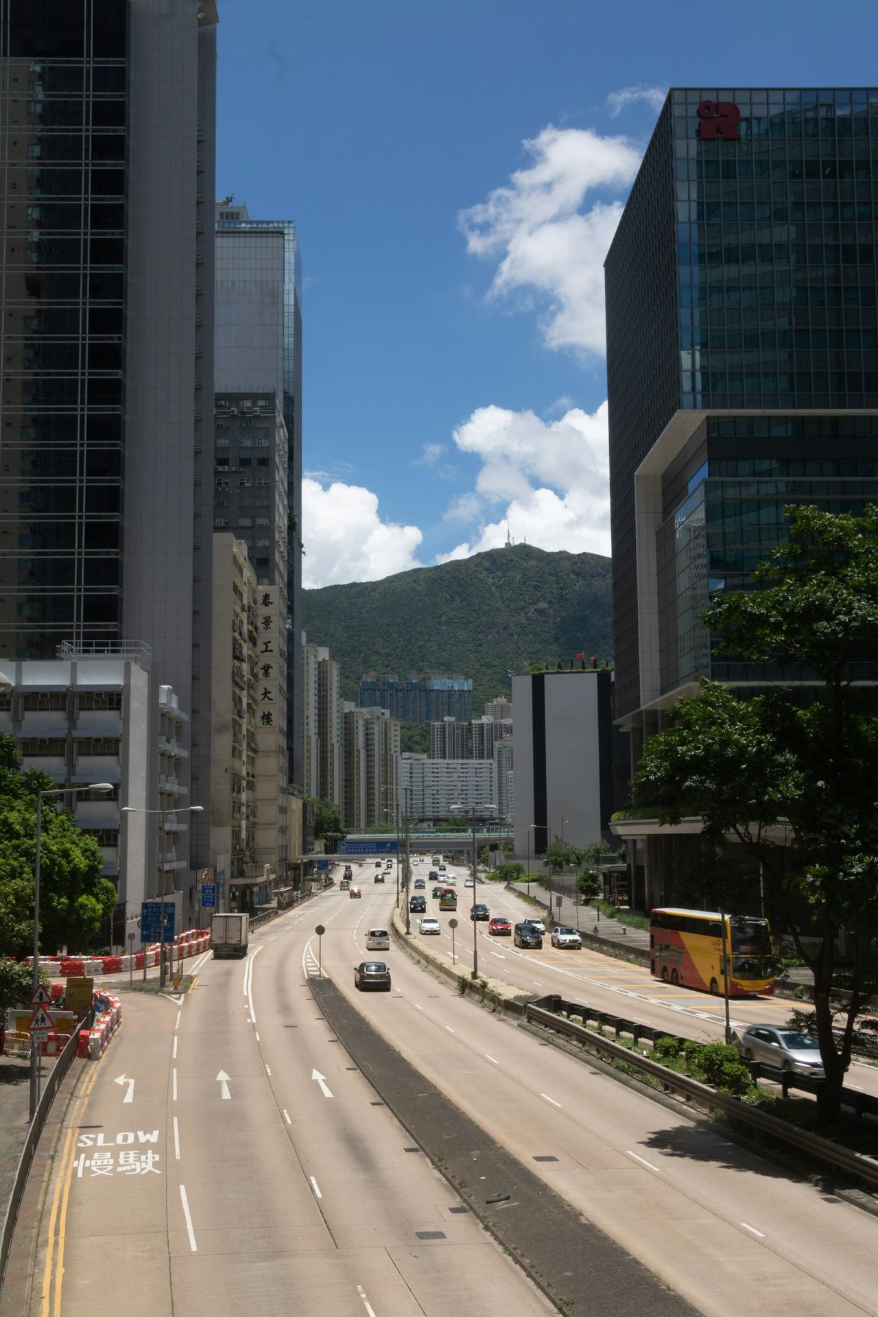 A view of a city street with tall buildings
